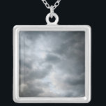 Storm Clouds Breaking Silver Plated Necklace<br><div class="desc">Dark stormy clouds are breaking apart in the foreground of this colour photograph. The cloud layers become lighter shades of grey deeper into the image. Hints of light blue sky are visible beyond the storm clouds as the weather starts to clear up. Digital, colour photograph. Copyright © 2010 Claire E....</div>