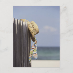 Straw Hat Hanging On Fence At Beach Postcard