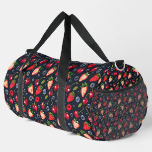 Strawberries and cherries on a dark background duffle bag