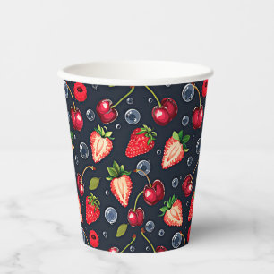 Strawberries and cherries on a dark background paper cups