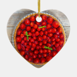 Strawberry cake with mint leaves on a rustic wood ceramic tree decoration