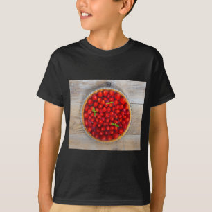 Strawberry cake with mint leaves on a rustic wood T-Shirt