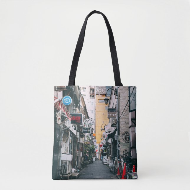 STREET BETWEEN GRAY CONCRETE BUILDINGS TOTE BAG (Front)