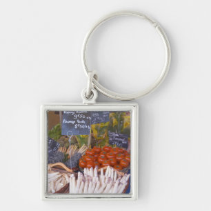 Street market merchant's stall with white key ring