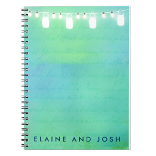 String lights and mason jars in blue green spiral notebook