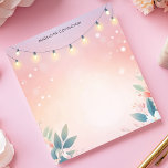 String Lights Floral Pastel Personalised Name Notepad<br><div class="desc">Create a magical and inviting atmosphere with this personalised notepad. Delicate string lights are draped across the top, with subtle floral and foliage accents along the bottom, creating a charming border. The soft, pastel background enhances the warm, twinkling effect. Add your own text to customise this notepad. Perfect for evening...</div>
