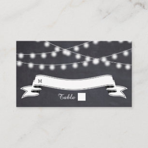 String of lights on chalkboard wedding place card