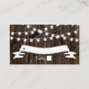 String of lights on old wood wedding place card