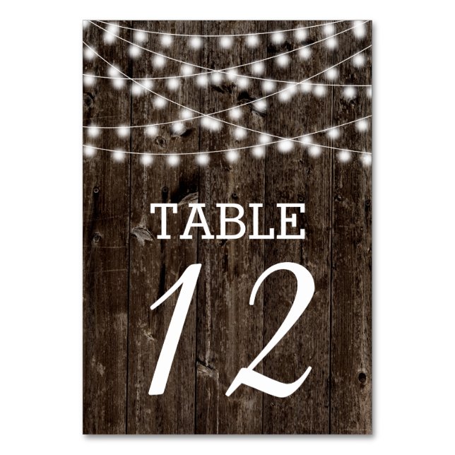 String of lights on old wood wedding table number (Front)