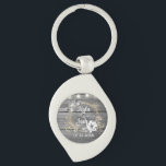Stringed Lights Wreath Rustic Wedding   Key Ring<br><div class="desc">On this stylish party favour wedding keychain is a grey rustic wood backdrop is a chic floral wreath where you can customise it and above that is a string of lights creating farmhouse romantic elegance.  Part of the Stylish Trendy Wedding Gifts Collection</div>