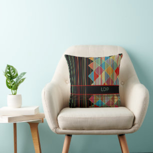 Striped Triangle Shapes with Initials on Black Cushion