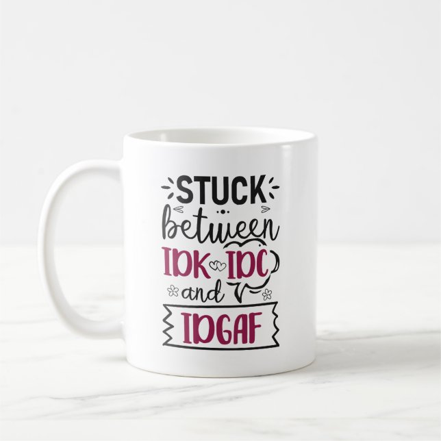 Stuck Between IDK, IDC And IDGAF Funny Quote Coffee Mug (Left)