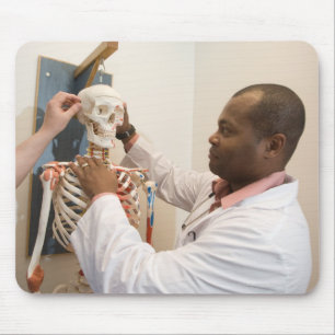 Student doctors studying anatomy on a skeleton mouse pad