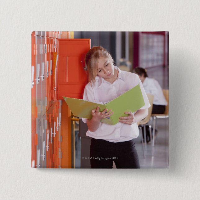 Student removing binder from school locker 15 cm square badge (Front)