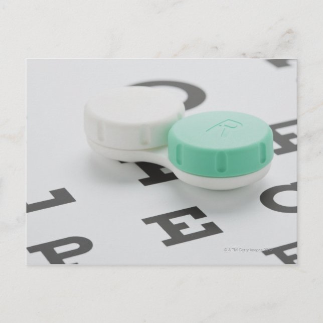 Studio shot of contact lens case on eye chart postcard (Front)