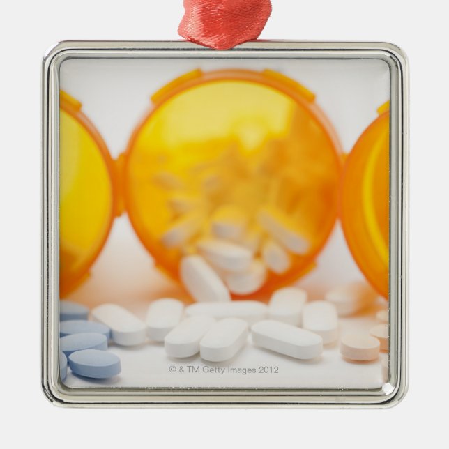 Studio shot of medicine bottle with pills metal tree decoration (Front)