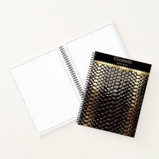Studying black and gold snake patterns notebook