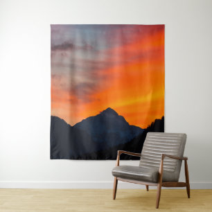Stunning vibrant sunset behind mountain tapestry