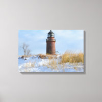 Sturdy Lighthouse on a Rocky Coast in Winter