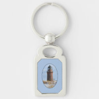 Sturdy Lighthouse on a Rocky Coast in Winter