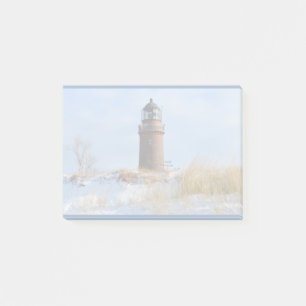 Sturdy Lighthouse on a Rocky Coast in Winter Post-it Notes