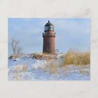 Sturdy Lighthouse on a Rocky Coast in Winter