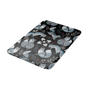 Stylised blue foxes with intricate floral designs Bath Mat