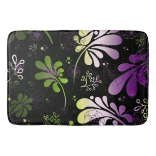 Stylised leaves and flowers on black background  bath mat