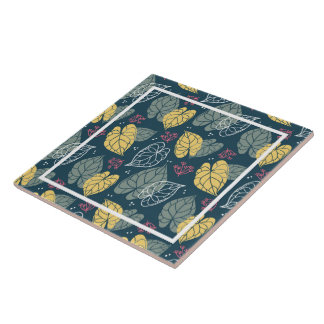 Stylised yellow and sage-green tropical leaves tile