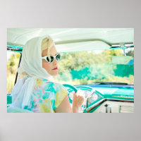 Stylish 1950s woman driving a classic automobile,