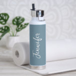 Stylish Dusty Blue White Script Womens Water Bottle<br><div class="desc">Stay hydrated during you gym workout with this Stylish Dusty Blue White Script Women's Water Bottle. It is trendy modern designed with trendy blue background around the bottle. Name is in white hand script lettering vertical on centre front. Perfect gift idea for her! CLICK PERSONALIZE TEMPLATE OPTION AND ENTER NAME....</div>