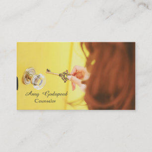 stylish girl looking for a keyhole in the door business card