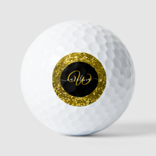 Stylish monogram gold glitter name black golf balls