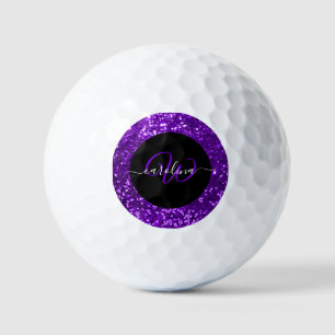 Stylish monogram purple glitter name black golf balls