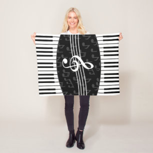Stylish musical note clef and piano keys fleece blanket