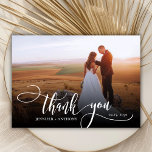 Stylish Script 2 Photo Wedding Thank You Card<br><div class="desc">Elegant Modern Chic Boho Calligraphy Script Wedding 2 Photo Thank You Card. Stylish wedding thank you template featuring a full vertical photo on the front with the text "Thank You" in a whimsical swirly hand lettering typography script swash tail font white overlay on the picture and a reverse side one...</div>
