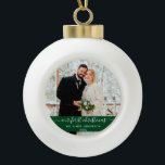 Stylish Script Our First Christmas Green Ceramic Ball Christmas Ornament<br><div class="desc">Elegant Stylish Trendy Script Our First Christmas Wedding Photo Green Ornament</div>