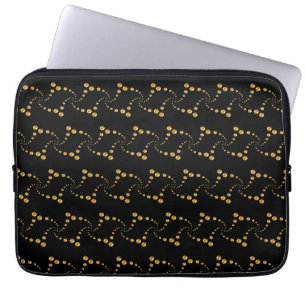 Stylish swirling golden polka dots on black laptop sleeve