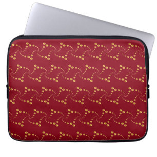 Stylish swirling golden polka dots on burgundy red laptop sleeve