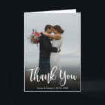 Stylish Wedding Photo Thank You Script Folded Card<br><div class="desc">Handwritten Script Modern Minimalist Wedding Photo Thank You folded card. This wedding thank you card template featuring a full vertical photo on the front with the text "Thank You" in a huge hand lettered calligraphy script font in white colour on the picture. Personalise your custom name and thank you message....</div>