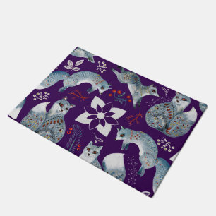 Stylized blue foxes with intricate floral designs Doormat