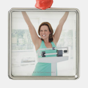 Successful weight loss. Happy woman weighing Metal Tree Decoration