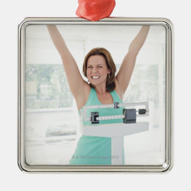 Successful weight loss. Happy woman weighing Metal Tree Decoration (Front)