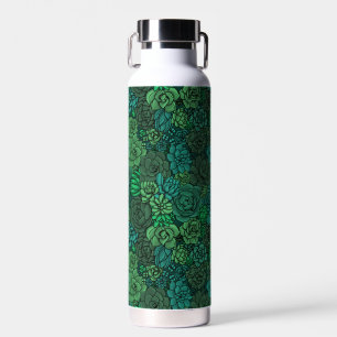 Succulent garden in green water bottle