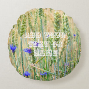 Summer wheat field with blue cornflowers round cushion