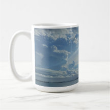 Sun and Clouds Over Water and City Coffee Mug