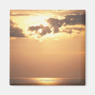 Sun goes down on the ocean magnet