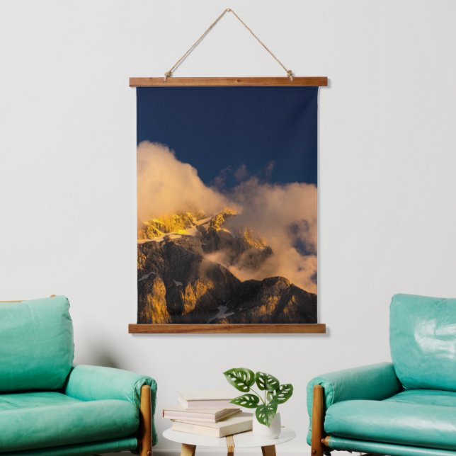 Sun lit mountains covered by clouds hanging tapestry (Living Room)