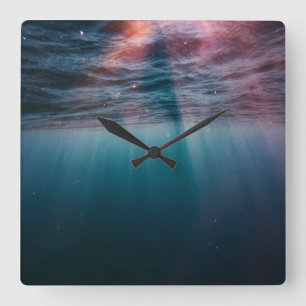 sun rays under water square wall clock