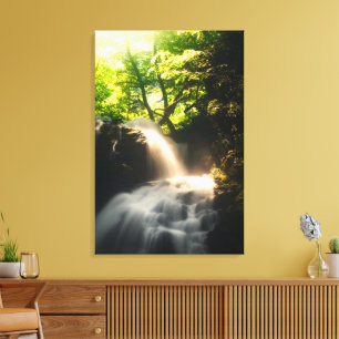 Sun shining on a magical waterfall canvas print